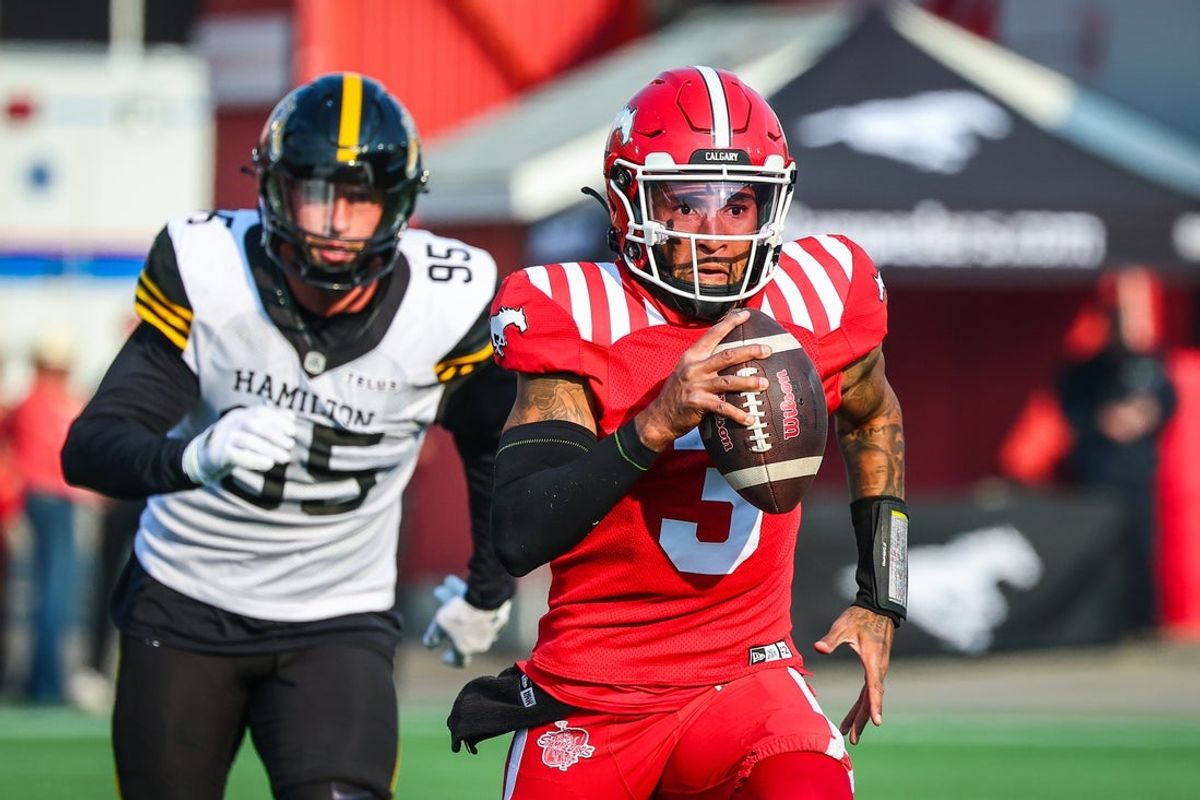 Jun 7, 2025; Calgary, Alberta, Canada; Calgary Stampeders quarterback Vernon Adams Jr (3) runs with the ball against the Hamilton Tiger-Cats during the second half at McMahon Stadium. Mandatory Credit: Sergei Belski-Imagn Images
