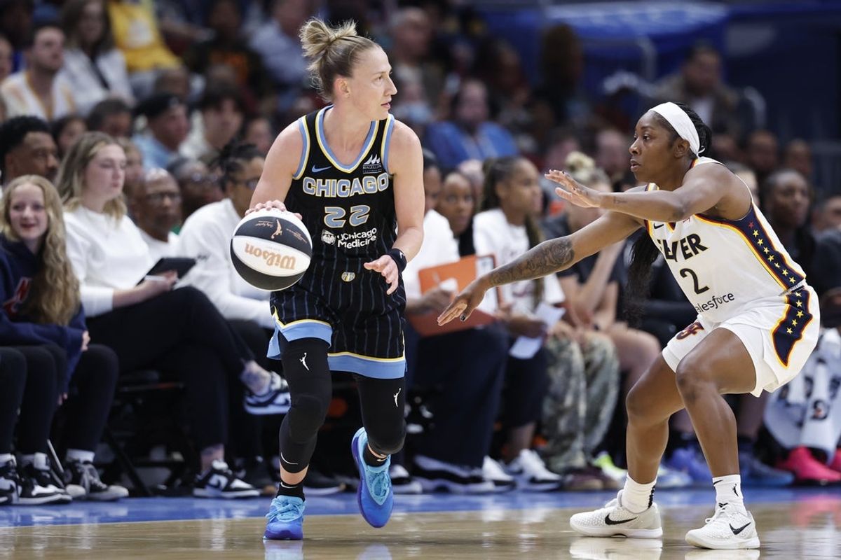 Jun 7, 2025; Chicago, Illinois, USA; Indiana Fever guard AariMcDonald (2) defends against Chicago Sky guard Courtney Vandersloot (22) during the first half of a WNBA game at United Center. Mandatory Credit: Kamil Krzaczynski-Imagn Images