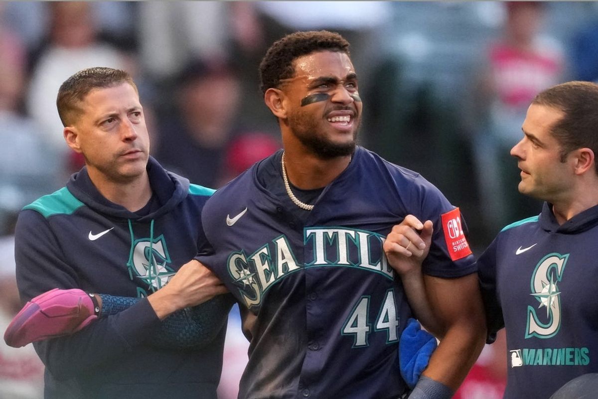 Jun 7, 2025; Anaheim, California, USA; Seattle Mariners center fielder Julio Rodriguez (44) leaves the game after being hit by a batted ball in the third inning against the Los Angeles Angels at Angel Stadium. Mandatory Credit: Kirby Lee-Imagn Images