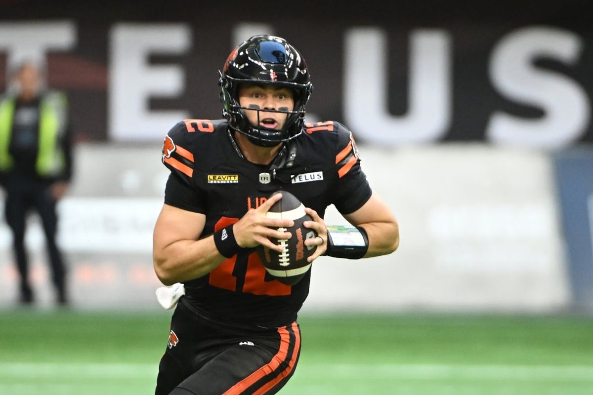 Jun 7, 2025; Vancouver, British Columbia, Canada;   BC Lions quarterback Nathan Rourke (12) looks to pass during the first half against the Edmonton Elks at BC Place Stadium. Mandatory Credit: Anne-Marie Sorvin-Imagn Images