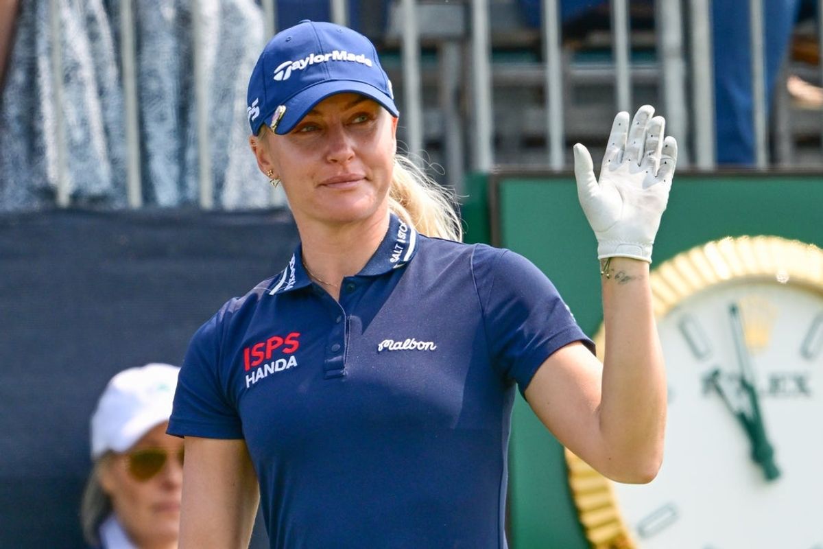 Jun 1, 2025; Erin, Wisconsin, USA; Charley Hull waves to fans during the final round of the U.S. Women's Open golf tournament. Mandatory Credit: Benny Sieu-Imagn Images