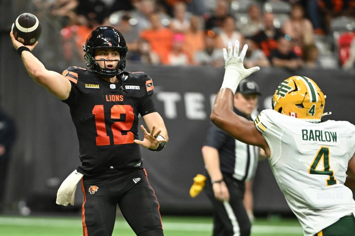 Jun 7, 2025; Vancouver, British Columbia, Canada;  BC Lions quarterback Nathan Rourke (12) looks to pass the ball during the second half against the Edmonton Elks  at BC Place Stadium. Mandatory Credit: Anne-Marie Sorvin-Imagn Images