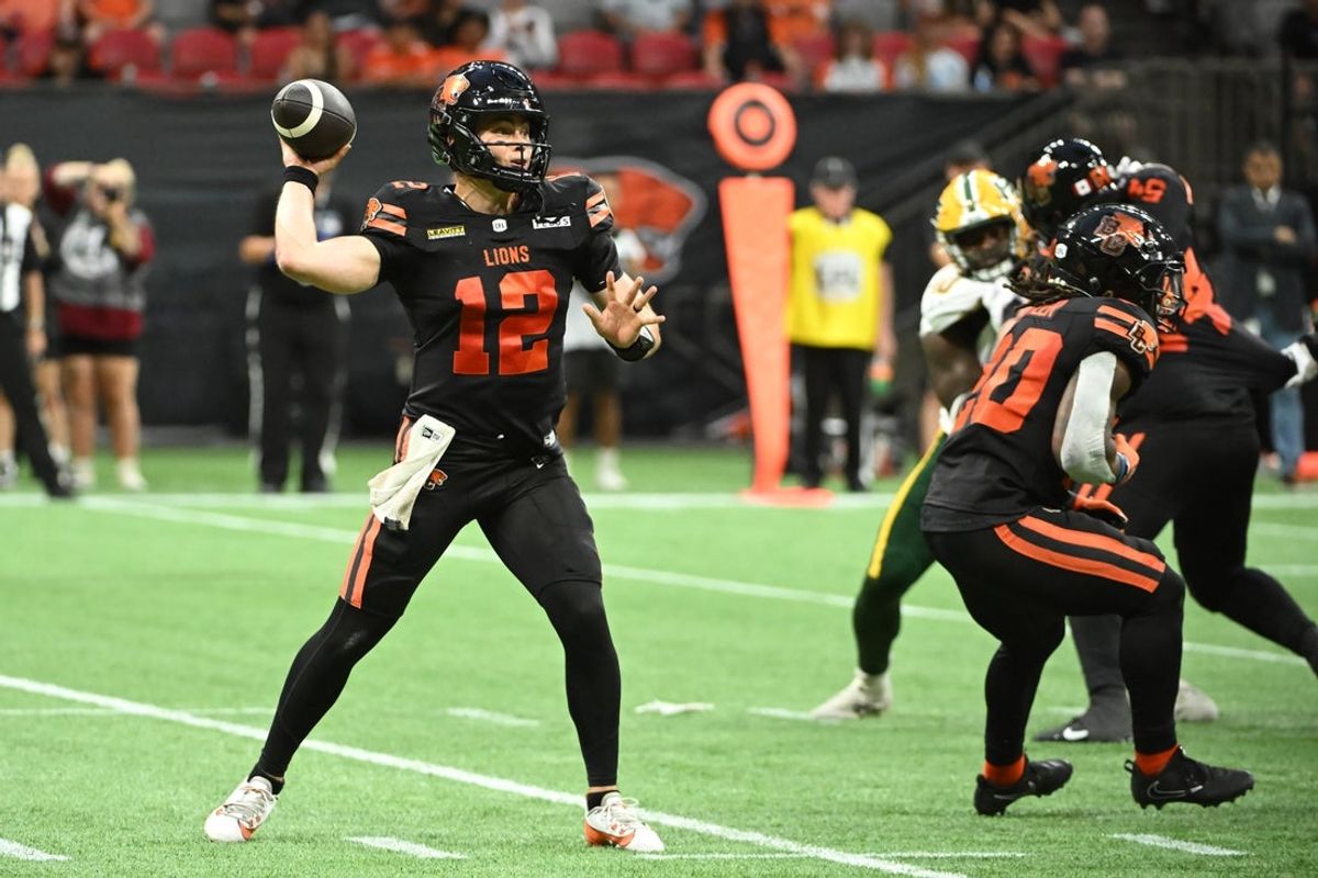 Jun 7, 2025; Vancouver, British Columbia, Canada;  BC Lions quarterback Nathan Rourke (12) looks to pass the ball during the second half against the Edmonton Elks  at BC Place Stadium. Mandatory Credit: Anne-Marie Sorvin-Imagn Images