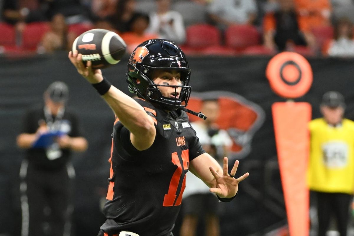 Jun 7, 2025; Vancouver, British Columbia, Canada;  BC Lions quarterback Nathan Rourke (12) looks to pass the ball during the second half against the Edmonton Elks  at BC Place Stadium. Mandatory Credit: Anne-Marie Sorvin-Imagn Images