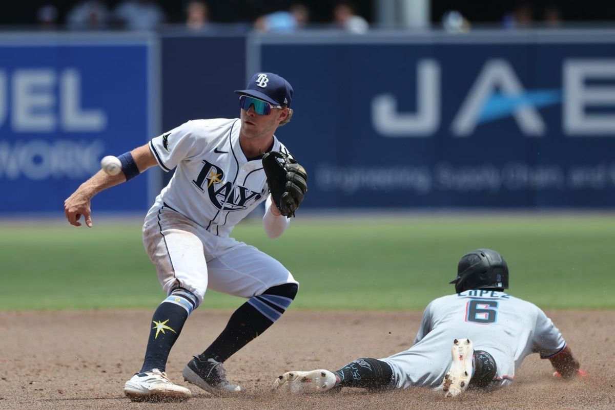 Jun 8, 2025; St. Petersburg, Florida, USA; Miami Marlins infielder Otto Lopez (6) slides safe into second base as Tampa Bay Rays shortstop Taylor Walls (6) attempted to tag him out during the third inning at George M. Steinbrenner Field. Mandatory Credit: Kim Klement Neitzel-Imagn Images