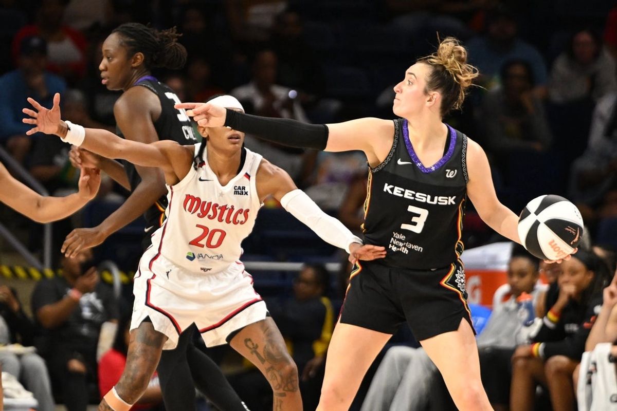Jun 8, 2025; Washington, District of Columbia, USA; Connecticut Sun guard Marina Mabrey (3) directs teammates in front of Washington Mystics guard Brittney Sykes (20) during the second quarter at CareFirst Arena. Mandatory Credit: Rafael Suanes-Imagn Images