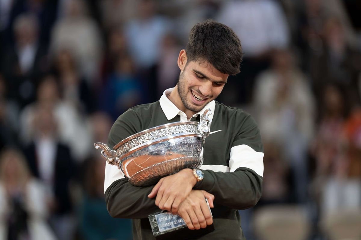 Jun 8, 2025; Paris, FR; Carlos Alcaraz of Spain poses with the trophy after winning the men’s singles final against Jannik Sinner of Italy on day 15 at Roland Garros Stadium. Mandatory Credit: Susan Mullane-Imagn Images
