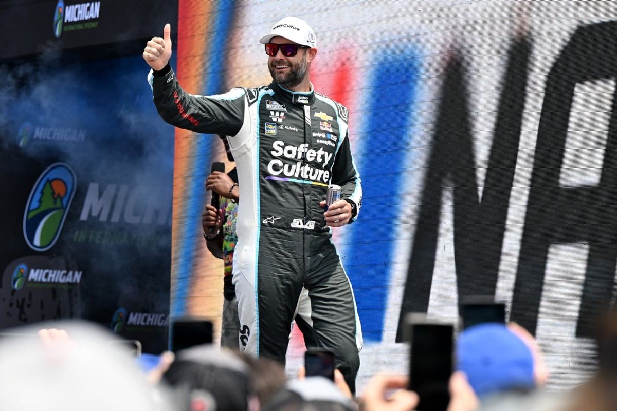 Jun 8, 2025; Brooklyn, Michigan, USA; NASCAR Cup Series driver Shane van Gisbergen (88) greets the crowd during driver introductions before the start of the FireKeepers Casino 400 at Michigan International Speedway. Mandatory Credit: Lon Horwedel-Imagn Images