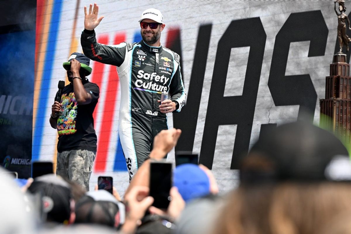 Jun 8, 2025; Brooklyn, Michigan, USA; NASCAR Cup Series driver Shane van Gisbergen (88) greets the crowd during driver introductions before the start of the FireKeepers Casino 400 at Michigan International Speedway. Mandatory Credit: Lon Horwedel-Imagn Images