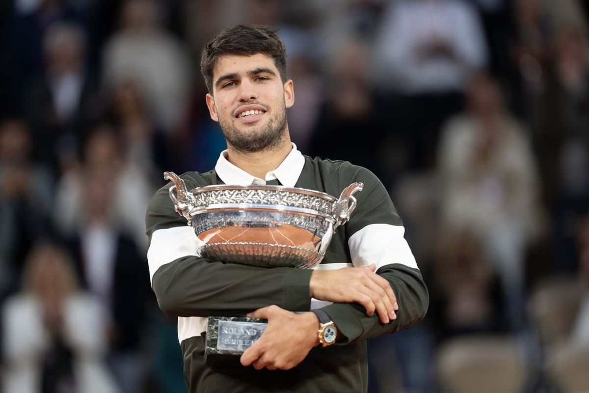 Jun 8, 2025; Paris, FR; Carlos Alcaraz of Spain poses with the trophy after winning the men’s singles final against Jannik Sinner of Italy on day 15 at Roland Garros Stadium. Mandatory Credit: Susan Mullane-Imagn Images