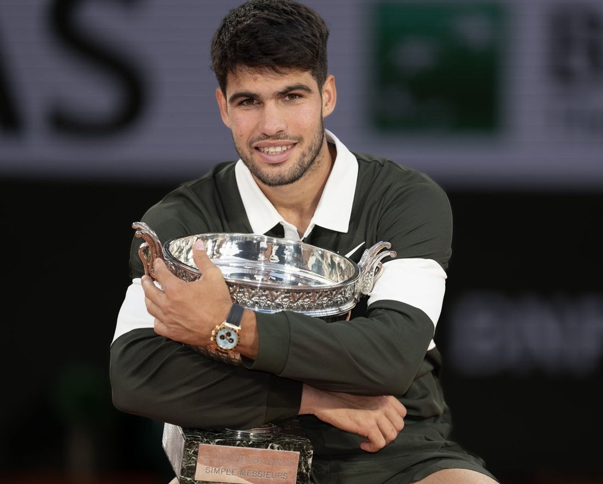 Jun 8, 2025; Paris, FR; Carlos Alcaraz of Spain poses with the trophy after winning the men’s singles final against Jannik Sinner of Italy on day 15 at Roland Garros Stadium. Mandatory Credit: Susan Mullane-Imagn Images