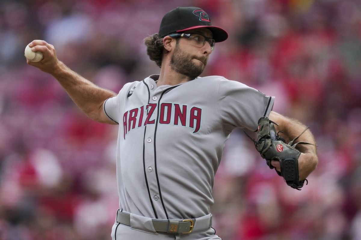 Jun 8, 2025; Cincinnati, Ohio, USA; Arizona Diamondbacks pitcher Zac Gallen (23) throws against the Cincinnati Reds in the sixth inning at Great American Ball Park. Mandatory Credit: Aaron Doster-Imagn Images