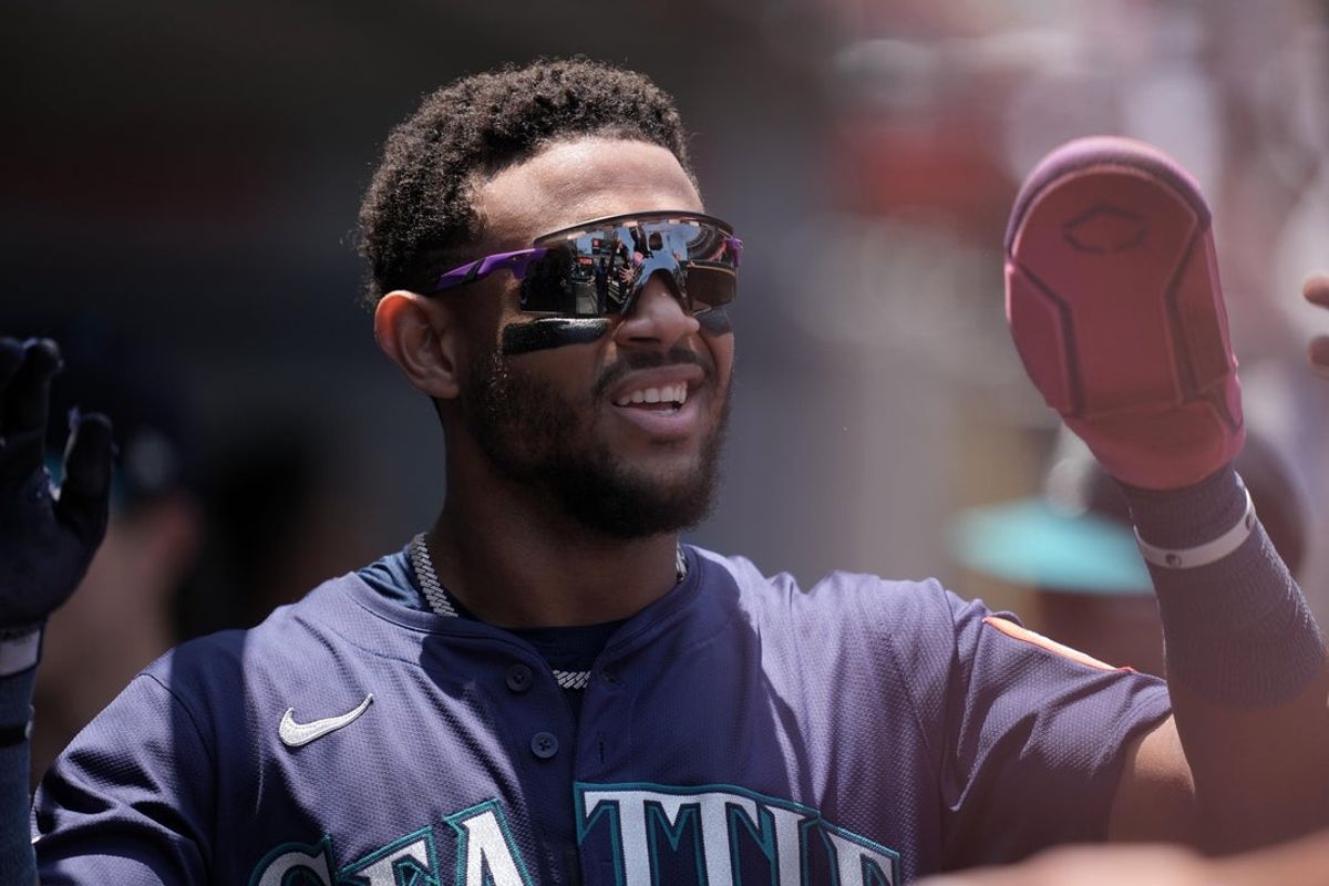 Jun 8, 2025; Anaheim, California, USA; Seattle Mariners center fielder Julio Rodriguez (44) reacts after scoring in the first inning against the Los Angeles Angels at Angel Stadium. Mandatory Credit: Kirby Lee-Imagn Images