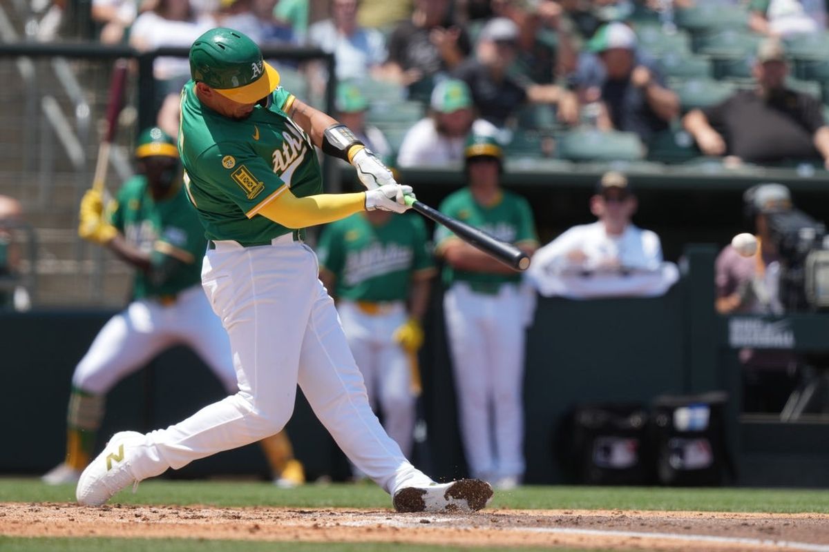 Jun 8, 2025; West Sacramento, California, USA; Athletics catcher Jhonny Pereda (64) hits an RBI double against the Baltimore Orioles during the second inning at Sutter Health Park. Mandatory Credit: Darren Yamashita-Imagn Images