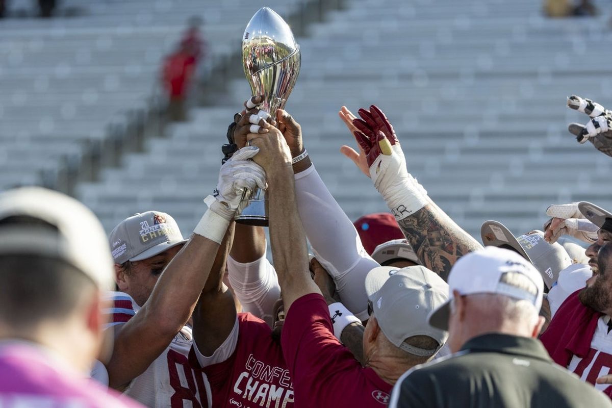 Jun 8, 2025; Birmingham, AL, USA; Michigan Panthers head coach Mike Nolan lifts the trophy with his team after a win over the Birmingham Stallions the USFL conference championship football game at Protective Stadium. Mandatory Credit: Vasha Hunt-Imagn Images