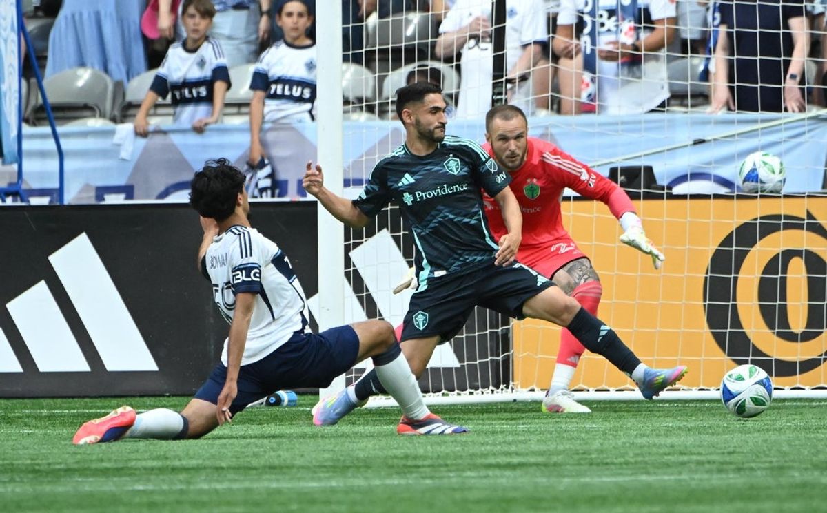 Jun 8, 2025; Vancouver, British Columbia, CAN; Vancouver Whitecaps FC midfielder Jeevan Badwal (59) scores a goal against Seattle Sounders goalkeeper Stefan Frei (24) during the first half at BC Place. Mandatory Credit: Simon Fearn-Imagn Images