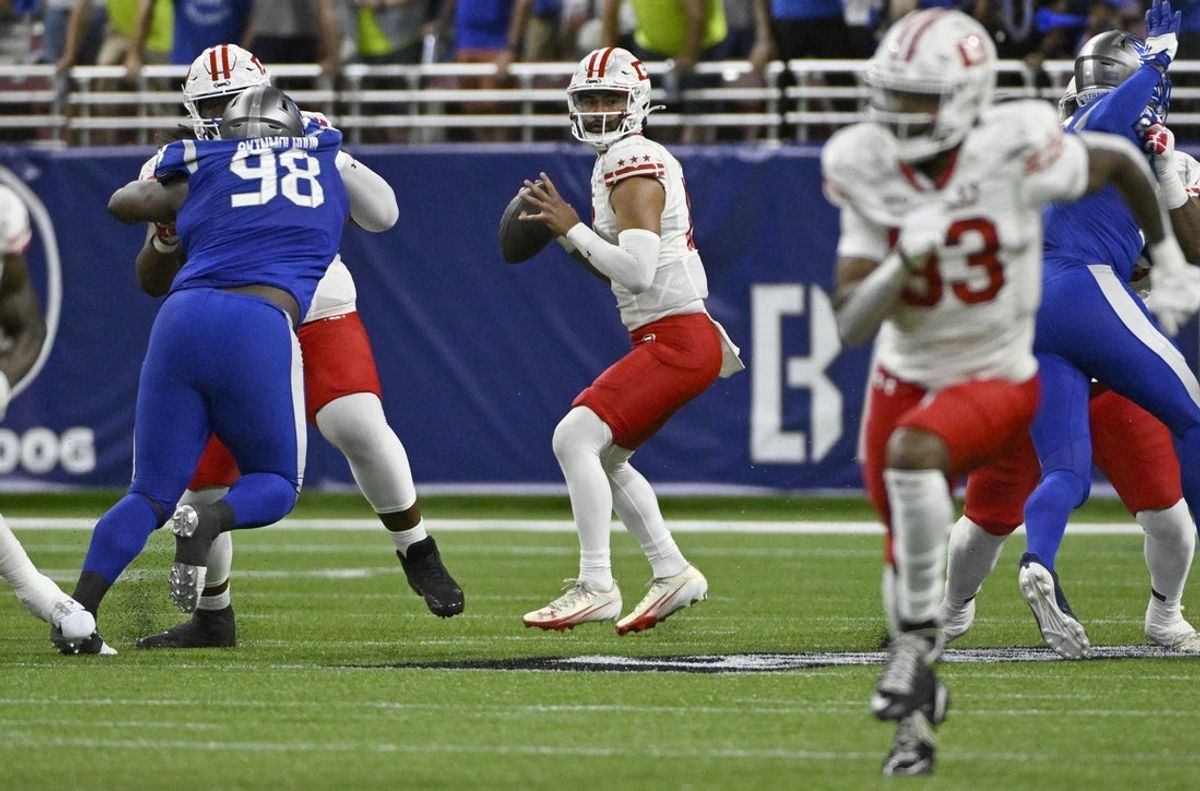 Jun 8, 2025; St. Louis, MO, USA; DC Defenders quarterback Jordan Ta'amu (10) looks to pass against the St. Louis Battlehawks during the first quarter at The Dome at America’s Center. Mandatory Credit: Jeff Le-Imagn Images