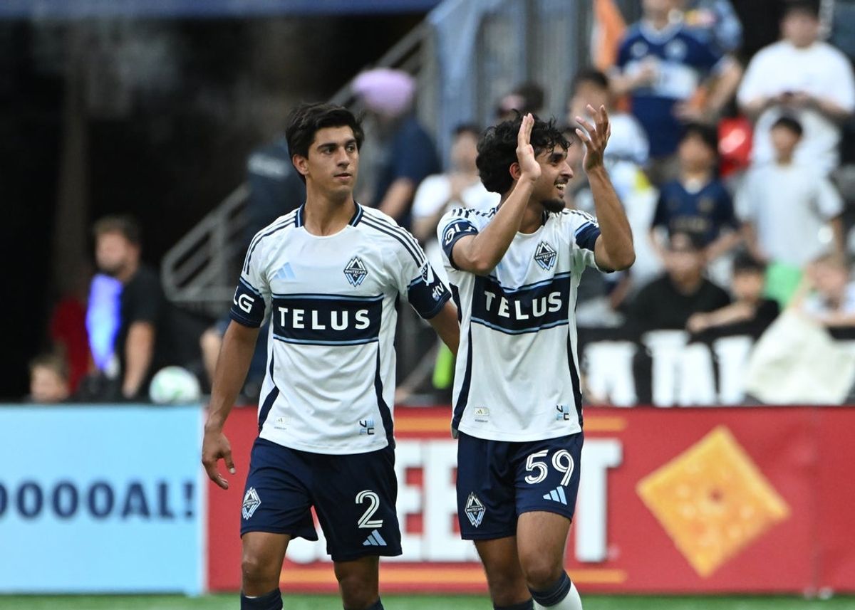 Jun 8, 2025; Vancouver, British Columbia, CAN; Vancouver Whitecaps FC midfielder Jeevan Badwal (59) celebrates a goal with defender Mathias Laborda (2) against the Seattle Sounders during the first half at BC Place. Mandatory Credit: Simon Fearn-Imagn Images