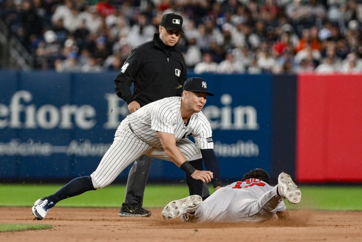 Jun 8, 2025; Bronx, New York, USA; New York Yankees shortstop Anthony Volpe (11) tags out Boston Red Sox second baseman David Hamilton (17) on a steal attempt during the eighth inning at Yankee Stadium. Mandatory Credit: John Jones-Imagn Images