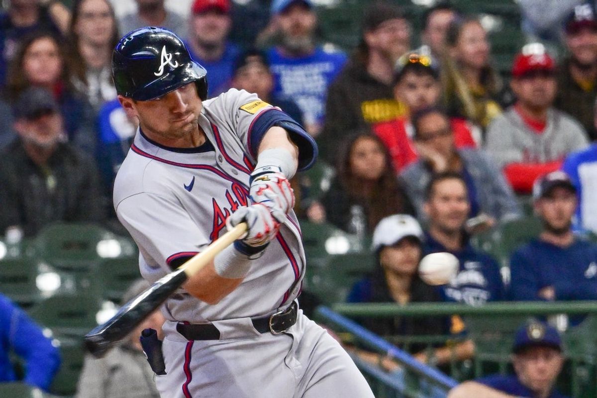 Jun 9, 2025; Milwaukee, Wisconsin, USA; Atlanta Braves third baseman Austin Riley (27) hits a single in the first inning against the Milwaukee Brewers at American Family Field. Mandatory Credit: Benny Sieu-Imagn Images