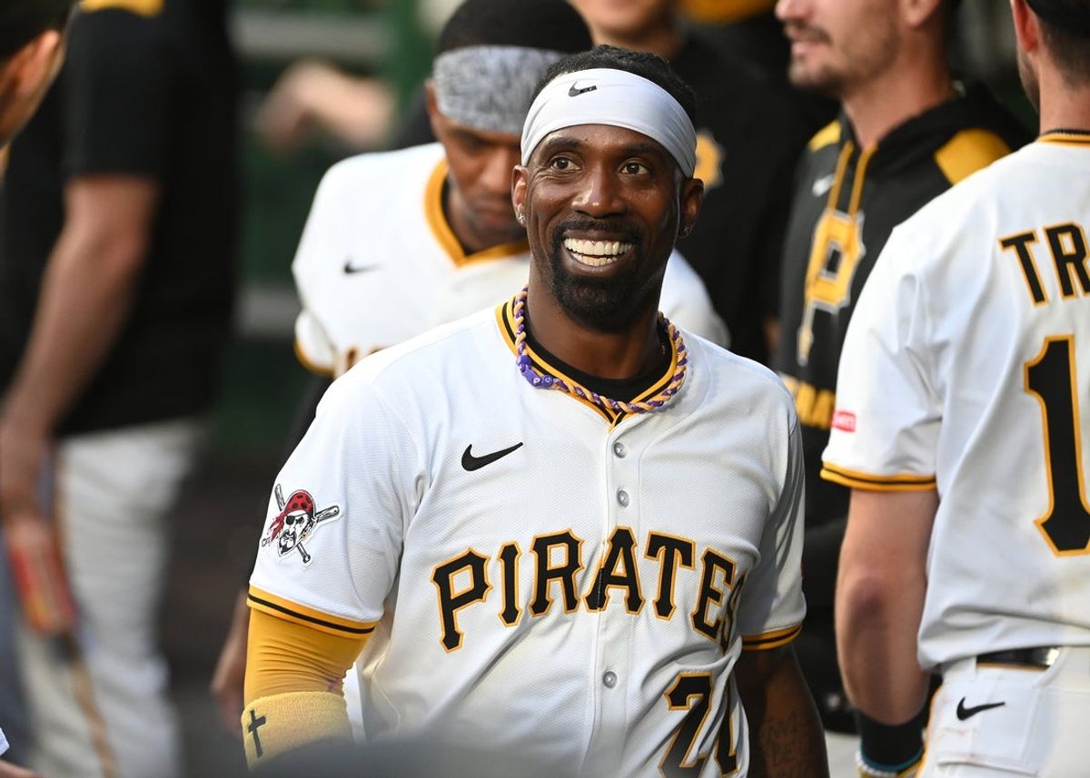 Jun 9, 2025; Pittsburgh, Pennsylvania, USA;  Pittsburgh Pirates designated hitter Andrew McCutchen (20) celebrates after scoring against the Miami Marlins during the third inning at PNC Park. Mandatory Credit: Philip G. Pavely-Imagn Images