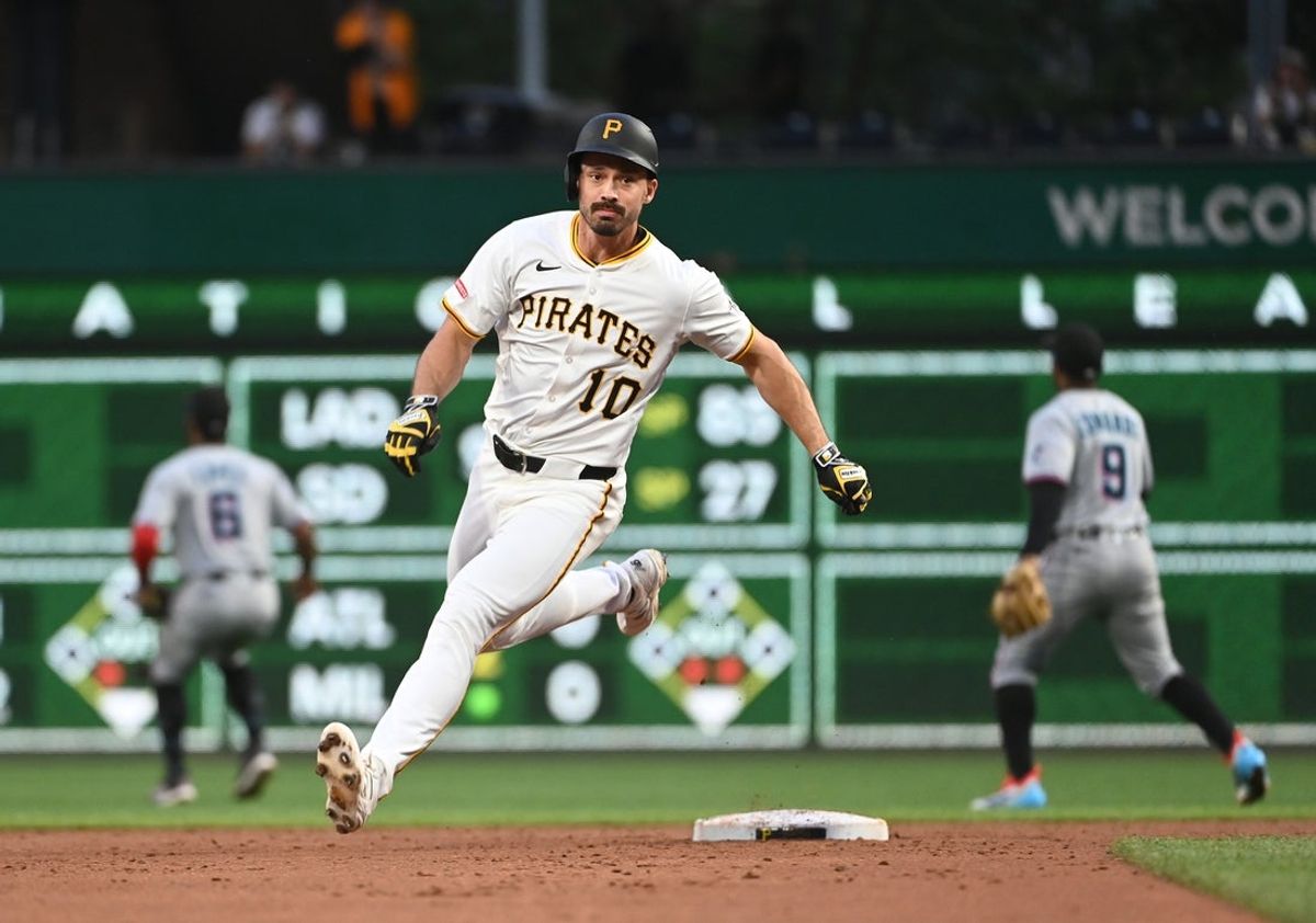 Jun 9, 2025; Pittsburgh, Pennsylvania, USA;  Pittsburgh Pirates Bryan Reynolds (10) races to third base for a bases clearing triple against the Miami Marlins during the third inning at PNC Park. Mandatory Credit: Philip G. Pavely-Imagn Images