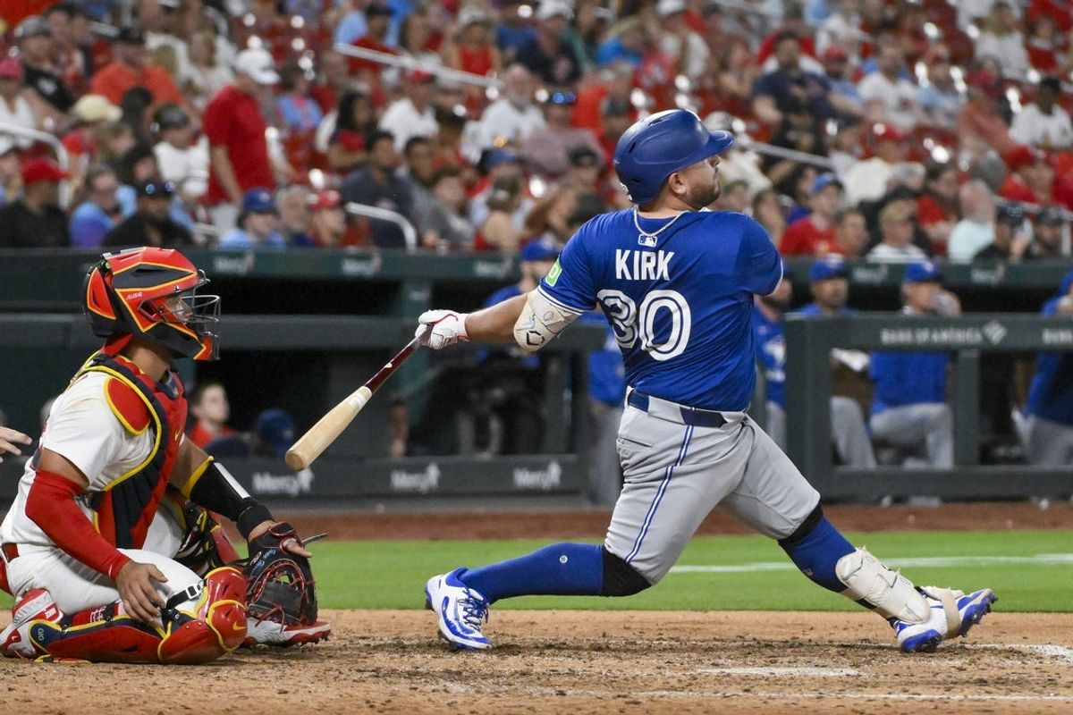 Jun 9, 2025; St. Louis, Missouri, USA;  Toronto Blue Jays catcher Alejandro Kirk (30) hits a solo home run against the St. Louis Cardinals during the eighth inning at Busch Stadium. Mandatory Credit: Jeff Curry-Imagn Images