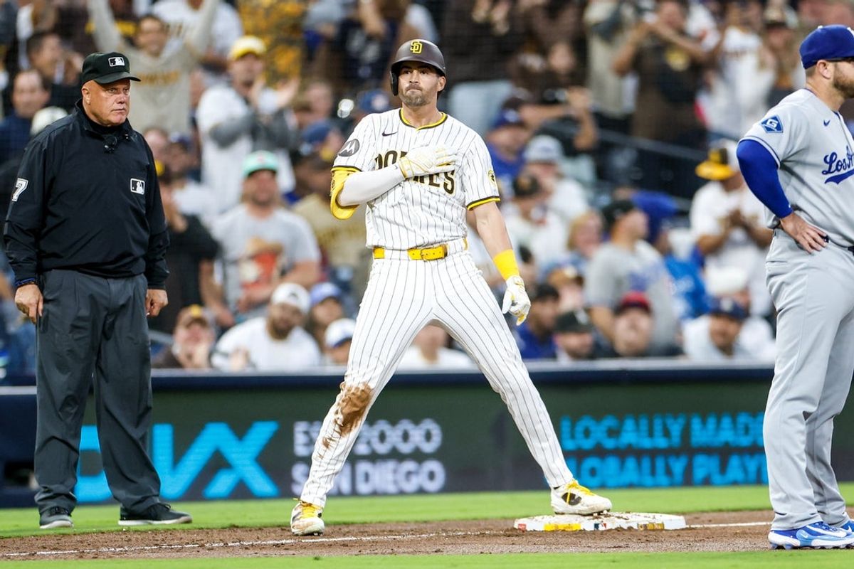 Jun 9, 2025; San Diego, California, USA; San Diego Padres left fielder Tyler Wade (14) celebrates after hitting a three run triple during the third inning against the Los Angeles Dodgers at Petco Park. Mandatory Credit: David Frerker-Imagn Images