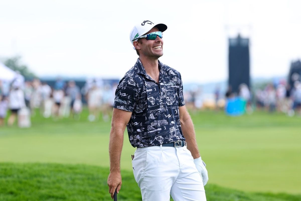 Jun 10, 2025; Oakmont, Pennsylvania, USA; Andrea Pavan laughs after attempting to hit out of the rough on the eighth hole during a practice round for the U.S. Open golf tournament at Oakmont Country Club. Mandatory Credit: Bill Streicher-Imagn Images
