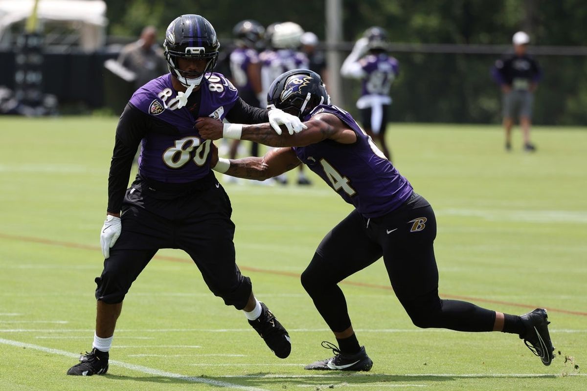 Jun 10, 2025; Baltimore, MD, USA; Baltimore Ravens tight end Isaiah Likely (80) runs past Baltimore Ravens tight end Zaire Mitchell-Paden (84) during an NFL OTA at Under Armour Performance Center. Mandatory Credit: Daniel Kucin Jr.-Imagn Images