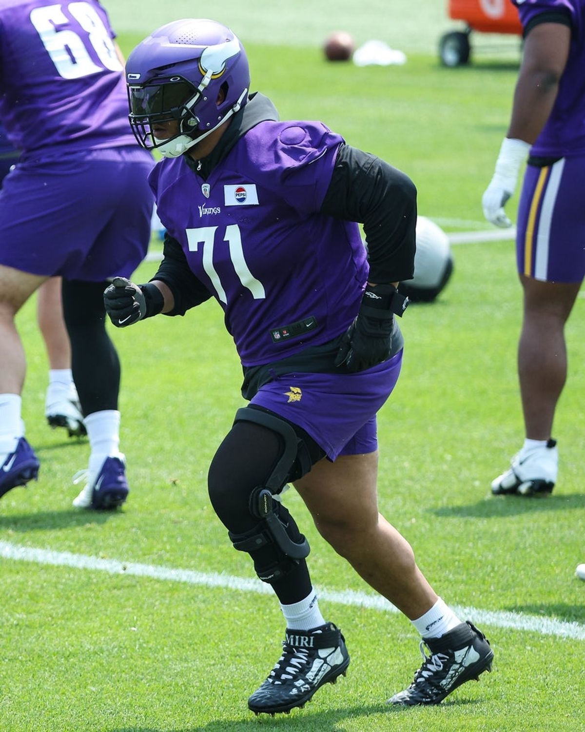 Jun 10, 2025; Minneapolis, MN, USA; Minnesota Vikings offensive tackle Christian Darrisaw (71) practices during minicamp at the Minnesota Vikings Training Facility. Mandatory Credit: Matt Krohn-Imagn Images