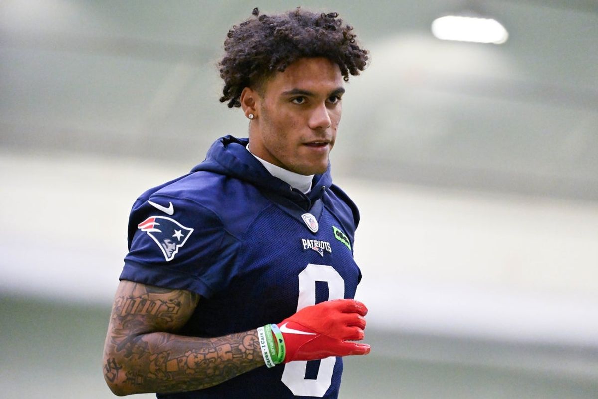 Jun 10, 2025; Foxborough, MA, USA; New England Patriots cornerback Christian Gonzalez (0) jogs to the sideline during minicamp held in the WIN Field House at Gillette Stadium. Mandatory Credit: Eric Canha-Imagn Images