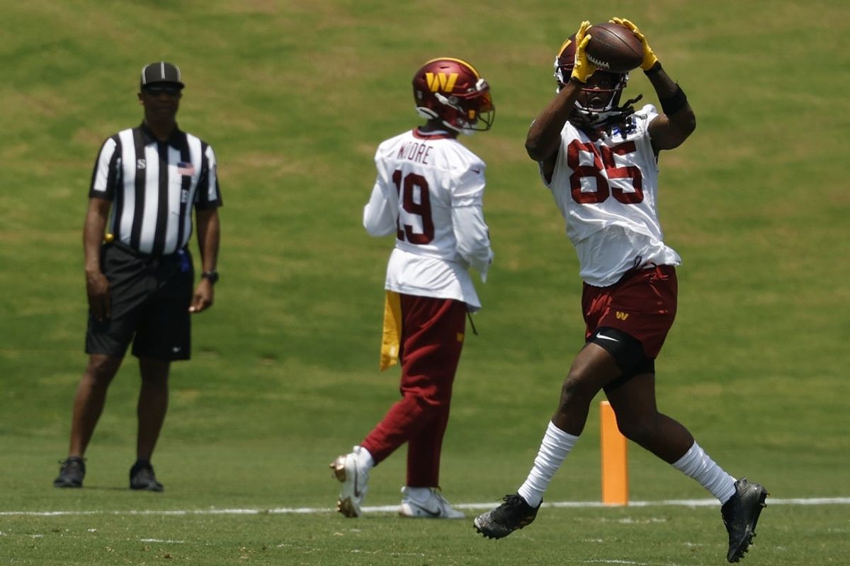 Jun 10, 2025; Ashburn, VA, USA; Washington Commanders wide receiver Noah Brown (85) catches a pass during drills on day one of minicamp at Commanders Park. Mandatory Credit: Geoff Burke-Imagn Images