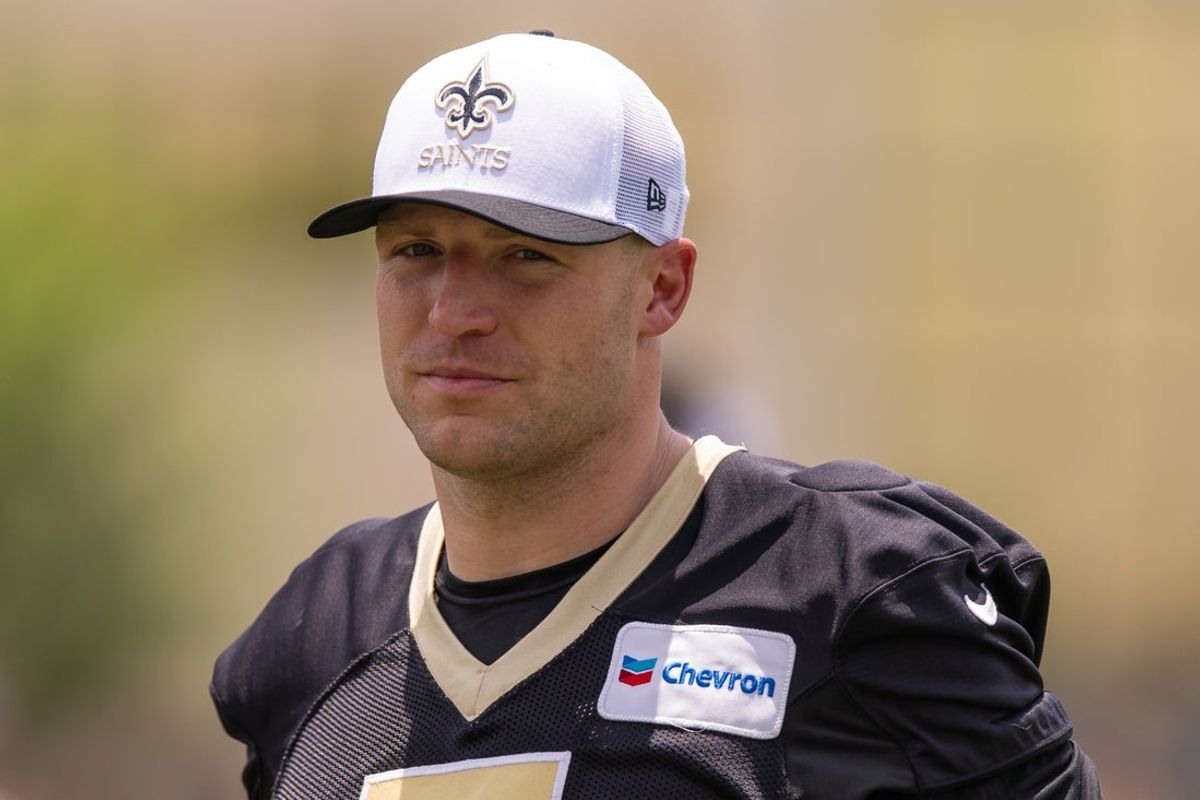 Jun 10, 2025; New Orleans, LA, USA;  New Orleans Saints tight end Taysom Hill (7) looks on during minicamp at Ochsner Sports Performance Center. Mandatory Credit: Stephen Lew-Imagn Images