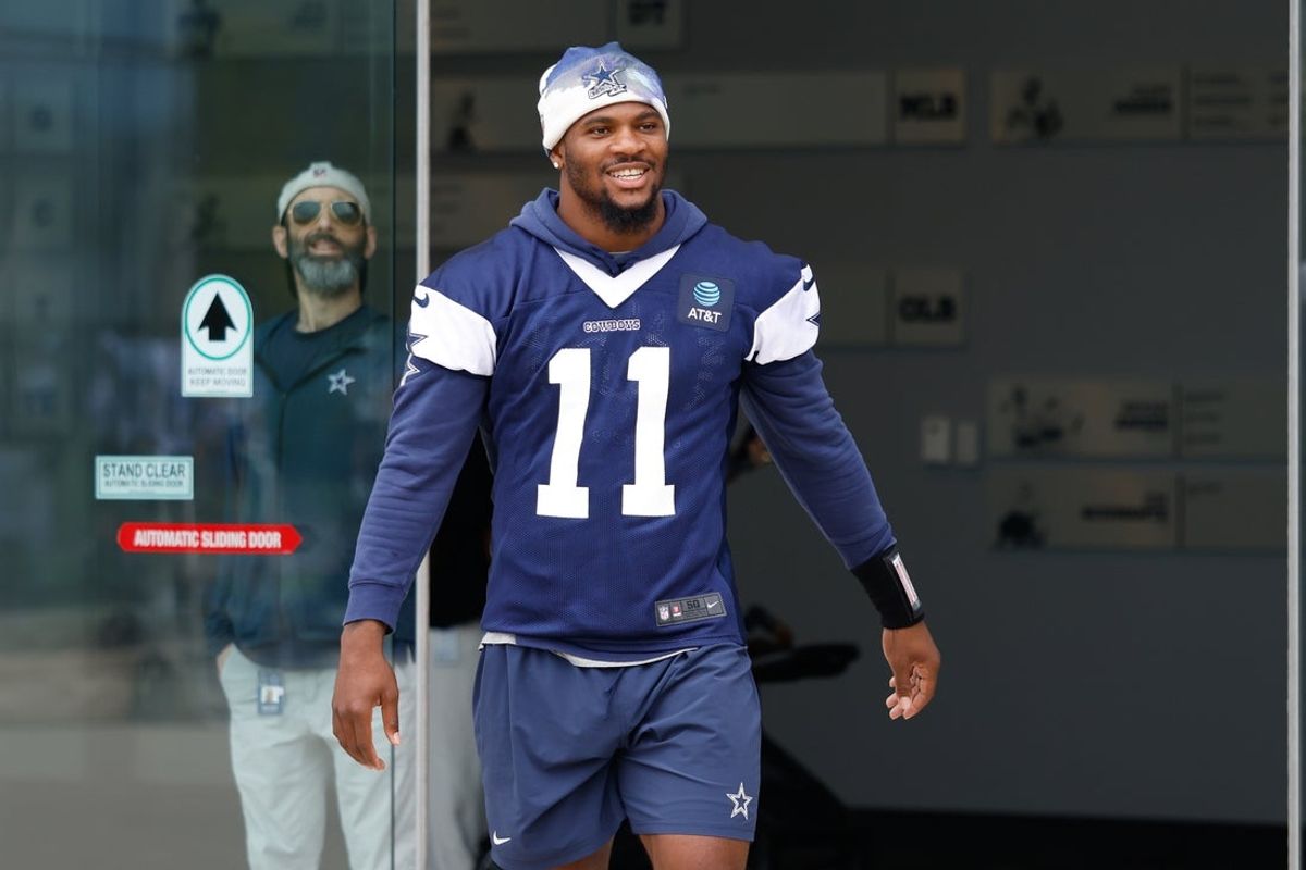 Jun 10, 2025; Arlington, TX, USA;  Dallas Cowboys defensive end Micah Parsons (11) walks onto the practice field at the Ford Center at the Star Training Facility in Frisco, Texas. Mandatory Credit: Chris Jones-Imagn Images