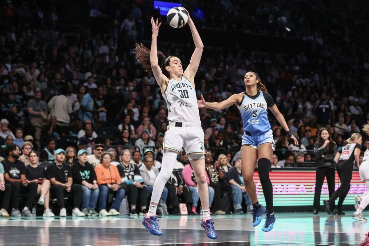Jun 10, 2025; Brooklyn, New York, USA;  New York Liberty forward Breanna Stewart (30) jumps past Chicago Sky forward Angel Reese (5) to grab a rebound in the first quarter at Barclays Center. Mandatory Credit: Wendell Cruz-Imagn Images