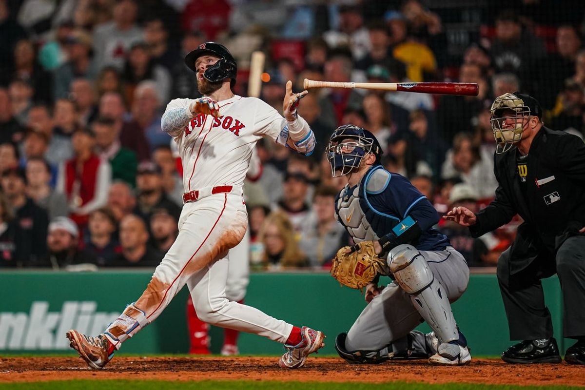 Jun 10, 2025; Boston, Massachusetts, USA; Boston Red Sox shortstop Trevor Story (10) hits a home run against the Tampa Bay Rays in the sixth inning at Fenway Park. Mandatory Credit: David Butler II-Imagn Images