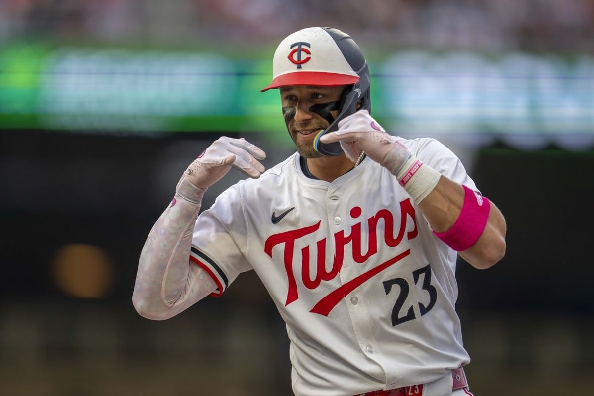 Jun 10, 2025; Minneapolis, Minnesota, USA; Minnesota Twins third baseman Royce Lewis (23) celebrates after hitting an RBI single against the Texas Rangers in the fourth inning at Target Field. Mandatory Credit: Jesse Johnson-Imagn Images