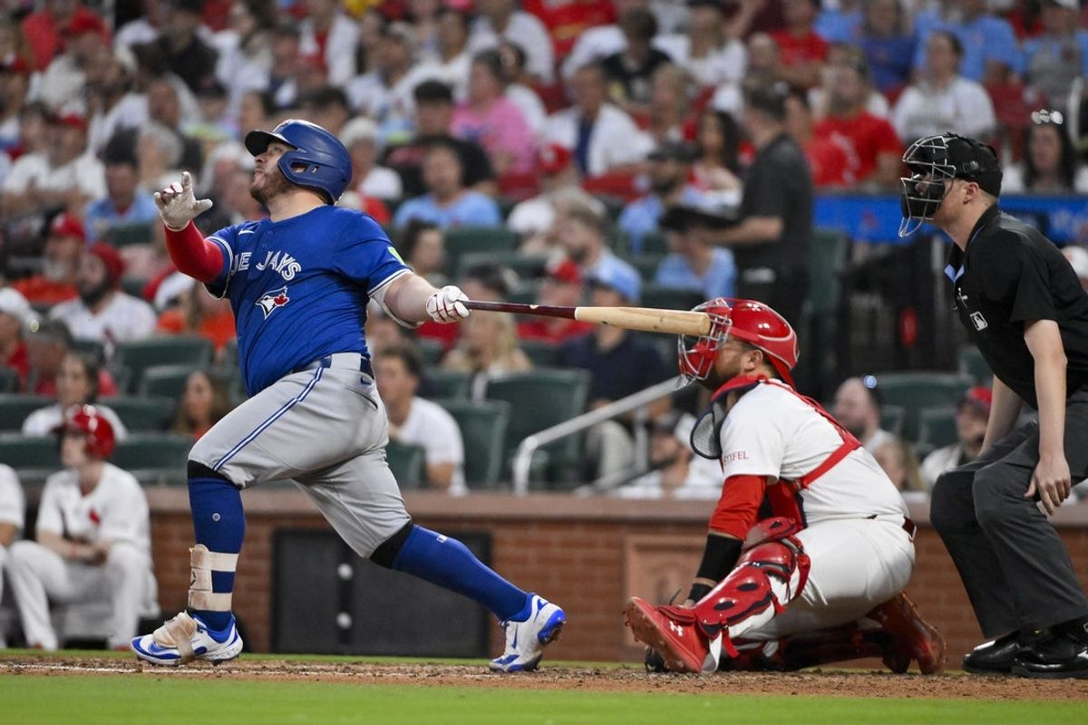 Jun 10, 2025; St. Louis, Missouri, USA;  Toronto Blue Jays catcher Alejandro Kirk (30) hits a two-run homer against the St. Louis Cardinals during the seventh inning at Busch Stadium. Mandatory Credit: Jeff Curry-Imagn Images