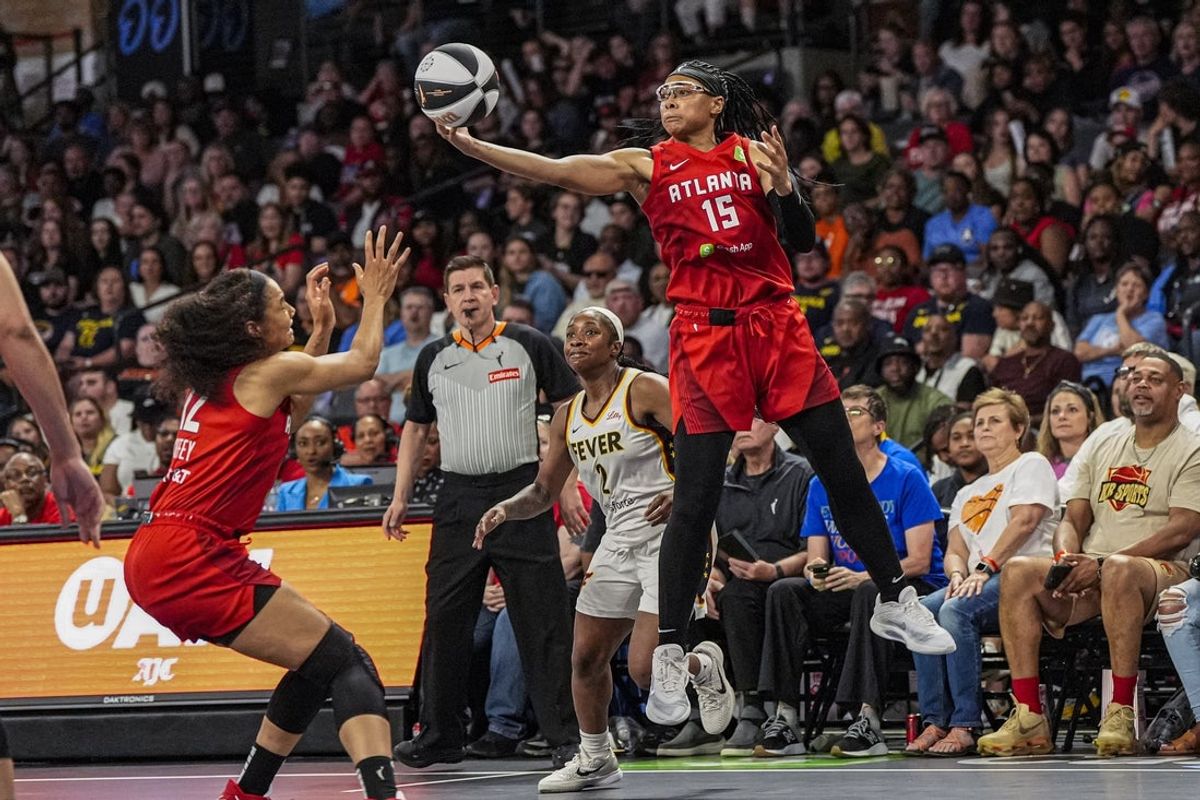 Jun 10, 2025; College Park, Georgia, USA; Atlanta Dream guard Allisha Gray (15) steals a pass against the Indiana Fever during the second half at Gateway Center Arena at College Park. Mandatory Credit: Dale Zanine-Imagn Images
