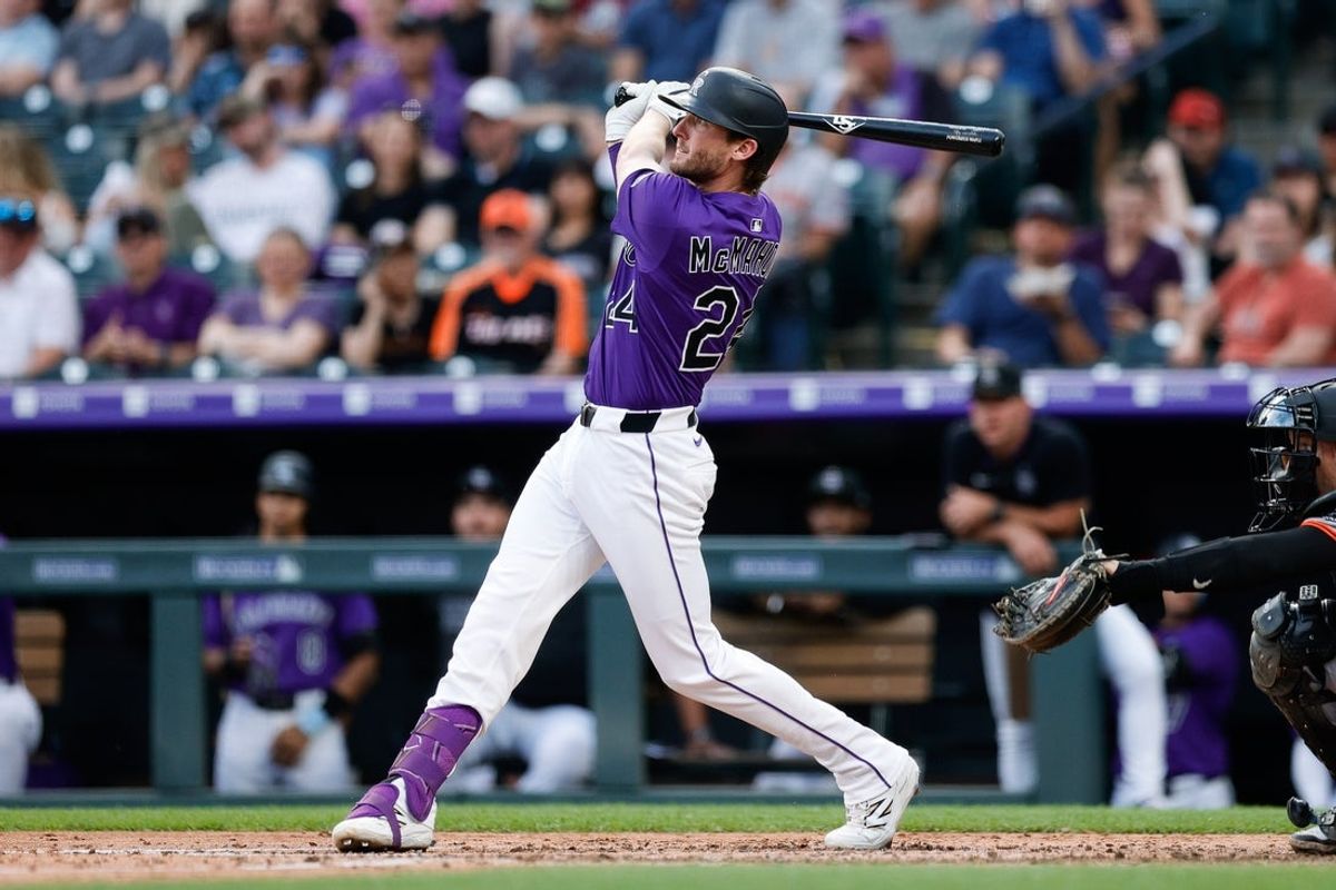Jun 10, 2025; Denver, Colorado, USA; Colorado Rockies third baseman Ryan McMahon (24) watches his ball on a solo home run in the fourth inning against the San Francisco Giants at Coors Field. Mandatory Credit: Isaiah J. Downing-Imagn Images