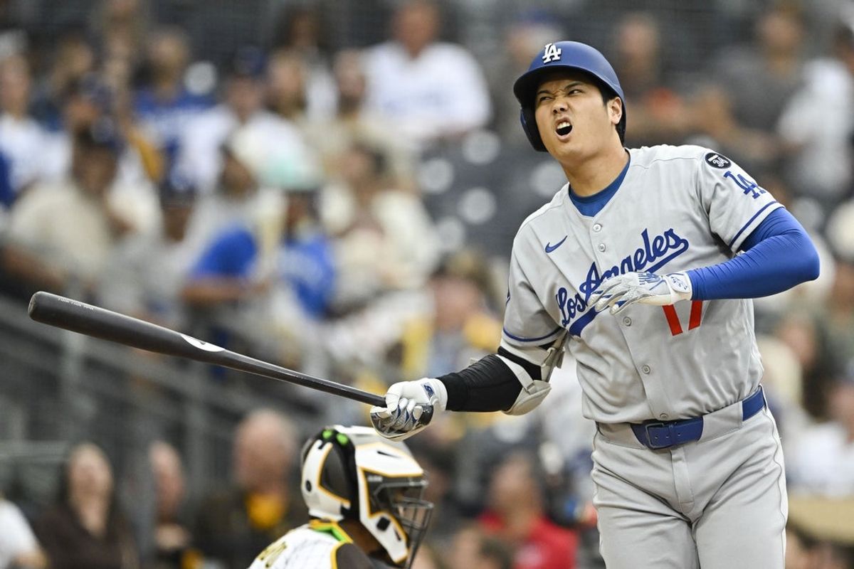 Jun 10, 2025; San Diego, California, USA; Los Angeles Dodgers designated hitter Shohei Ohtani (17) reacts after taking a strike during the first inning against the San Diego Padres at Petco Park. Mandatory Credit: Denis Poroy-Imagn Images