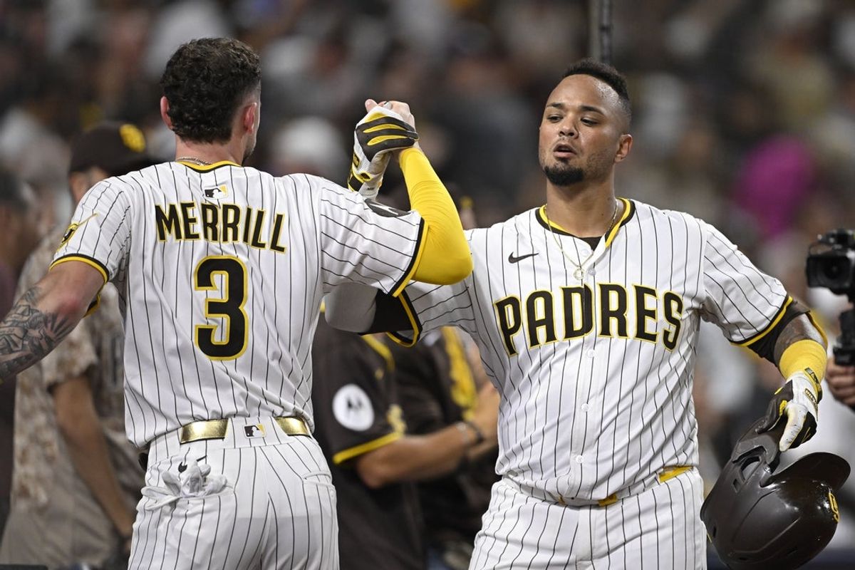 Jun 10, 2025; San Diego, California, USA; San Diego Padres catcher Martin Maldonado (15) is congratulated by Jackson Merrill (3) after hitting a solo home run during the sixth inning against the Los Angeles Dodgers at Petco Park. Mandatory Credit: Denis Poroy-Imagn Images