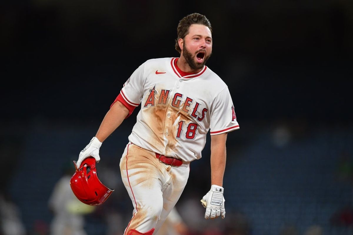 Jun 10, 2025; Anaheim, California, USA; Los Angeles Angels first baseman Nolan Schanuel (18) celebrates after hitting a walk off RBI single against the Athletics during the tenth inning at Angel Stadium. Mandatory Credit: Gary A. Vasquez-Imagn Images