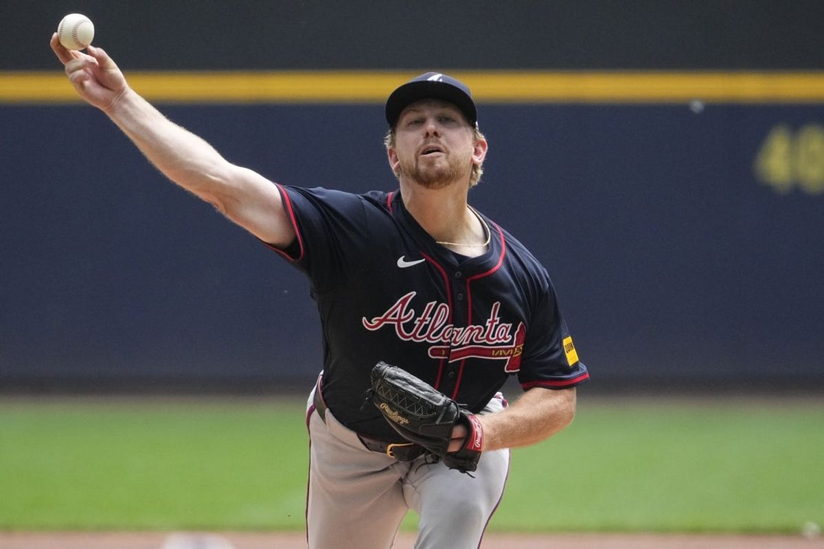 Jun 11, 2025; Milwaukee, Wisconsin, USA; Atlanta Braves pitcher Spencer Schwellenbach (56) delivers a pitch against the Milwaukee Brewers in the first inning at American Family Field. Mandatory Credit: Michael McLoone-Imagn Images