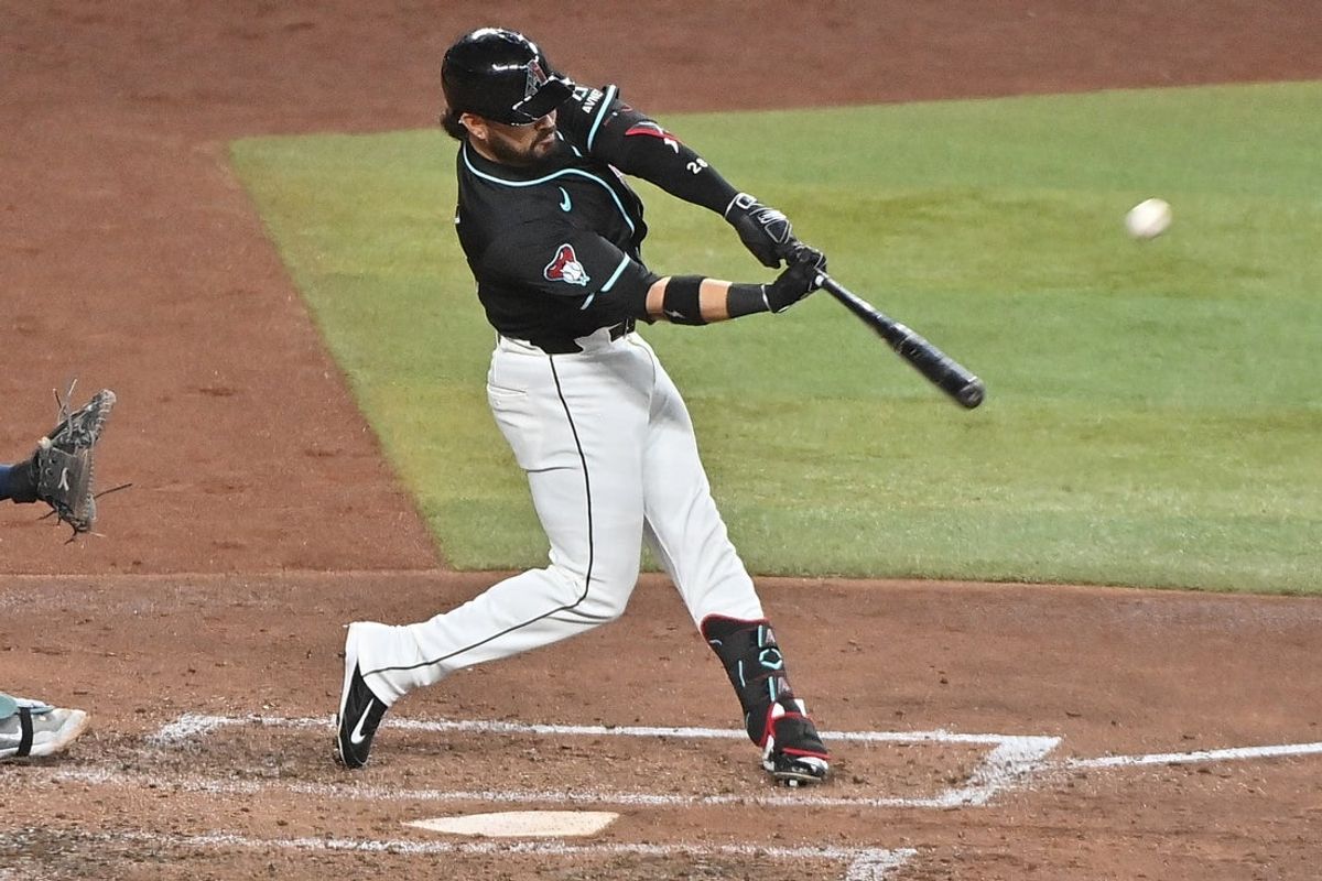 Jun 11, 2025; Phoenix, Arizona, USA;  Arizona Diamondbacks third baseman Eugenio Suarez (28) hits a grand slam home run in the sixth inning against the Seattle Mariners at Chase Field. Mandatory Credit: Matt Kartozian-Imagn Images