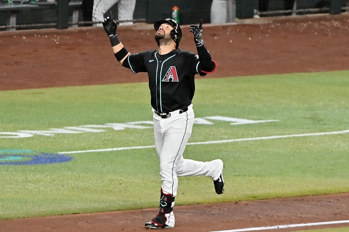 Jun 11, 2025; Phoenix, Arizona, USA;  Arizona Diamondbacks third base Eugenio Suarez (28) hits a grand slam home run in the sixth inning against the Seattle Mariners at Chase Field. Mandatory Credit: Matt Kartozian-Imagn Images