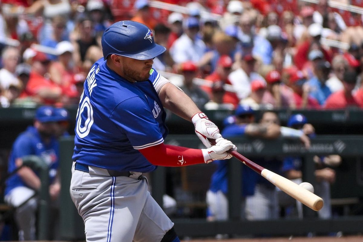 Jun 11, 2025; St. Louis, Missouri, USA;  Toronto Blue Jays designated hitter Alejandro Kirk (30) hits a single against the St. Louis Cardinals during the third inning at Busch Stadium. Mandatory Credit: Jeff Curry-Imagn Images