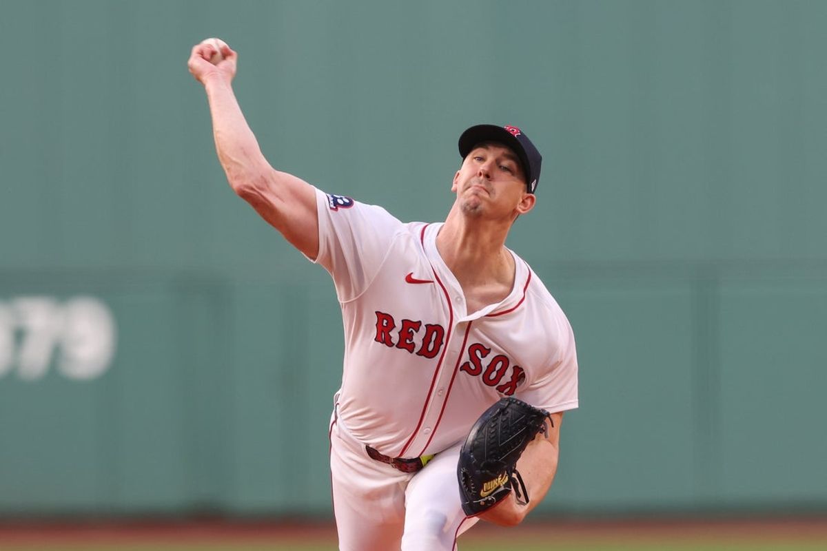 Jun 11, 2025; Boston, Massachusetts, USA; Boston Red Sox starting pitcher Walker Buehler (0) delivers a pitch during the first inning against the Tampa Bay Rays at Fenway Park. Mandatory Credit: Paul Rutherford-Imagn Images