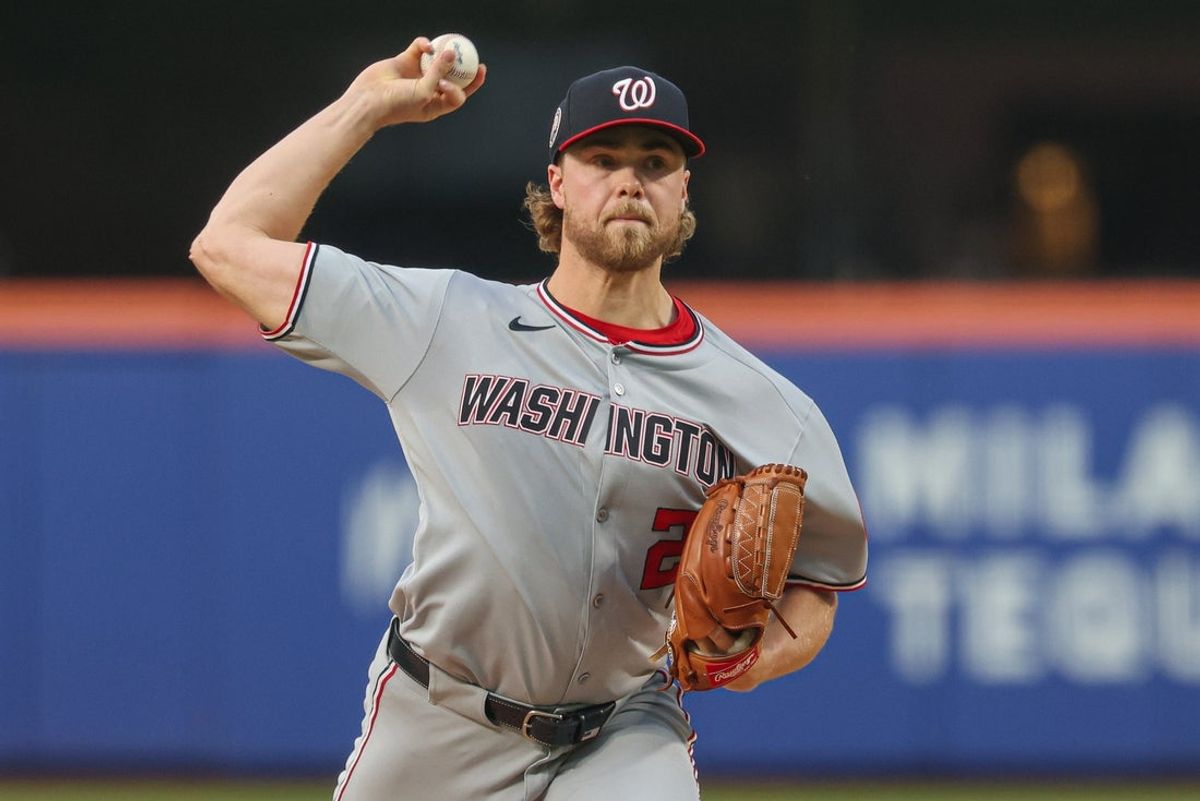 Jun 11, 2025; New York City, New York, USA; Washington Nationals starting pitcher Jake Irvin (27) delivers a pitch during the third inning against the New York Mets at Citi Field. Mandatory Credit: Vincent Carchietta-Imagn Images